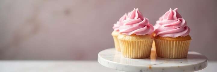 Delicate pastel pink cupcakes on a marble pedestal, sweet, pastel colors