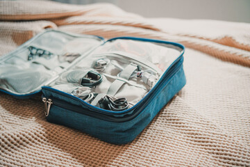 USB cables and chargers arranged in an organizer with compartments