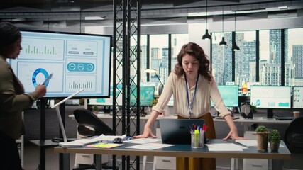 Group of businesswomen meeting in the office to align performance objectives with project indicators surrounded by reports and digital tools. Ambitious staff driving collective success. Camera A. - Powered by Adobe