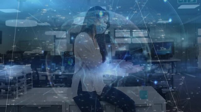 Woman gesturing palms summoning holographic data sphere in tech hub with coworker reviewing tablet