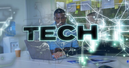 Collaborating IT pro and colleague analyzing code on laptop at office desk, with tech overlay