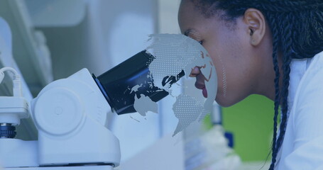 Peering scientist in lab coat examining sample using lab microscope, world map overlay, copy space
