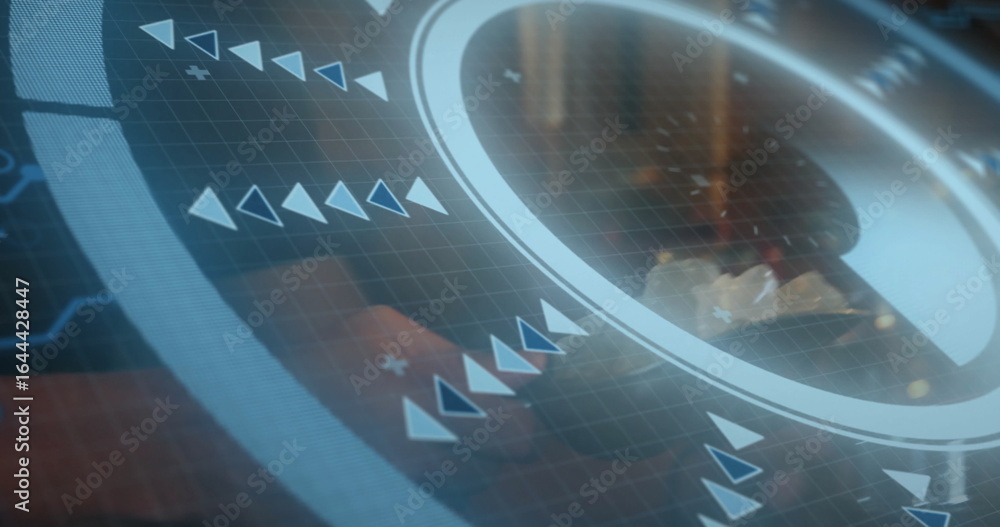 Poster showing circular interface overlaying office desk, with grid overlay, arrow icons and plus signs