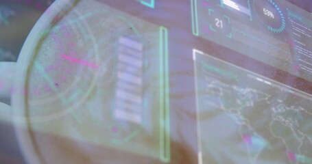 Projecting holographic display showing gauge chart map overlay at desk, with hand silhouette