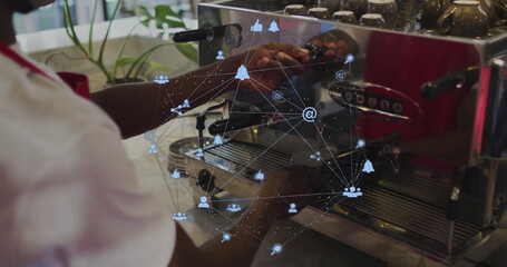 Operating espresso machine, barista at concrete coffee shop counter with potted plant, copy space