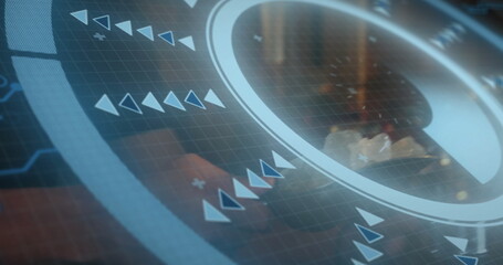 Showing circular interface overlaying office desk, with grid overlay, arrow icons and plus signs