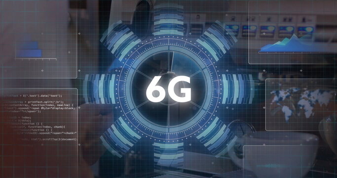 Displaying circular 6G holographic interface rotating over office desk, with laptop and smartphone