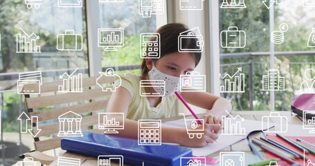 Using pink pencil, student wearing polka-dot mask writing in notebook at covered patio, with binder