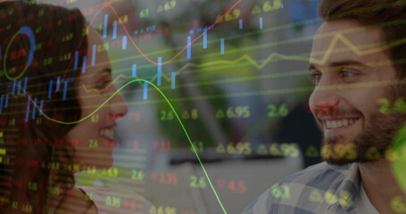 Smiling coworkers wearing shirts analyzing financial charts on monitor at office desk, with overlay