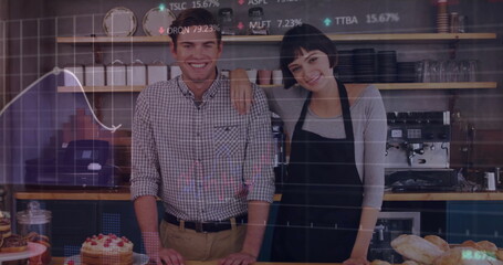 Smiling couple with apron standing behind counter in cafe, with baked goods and stock chart overlay