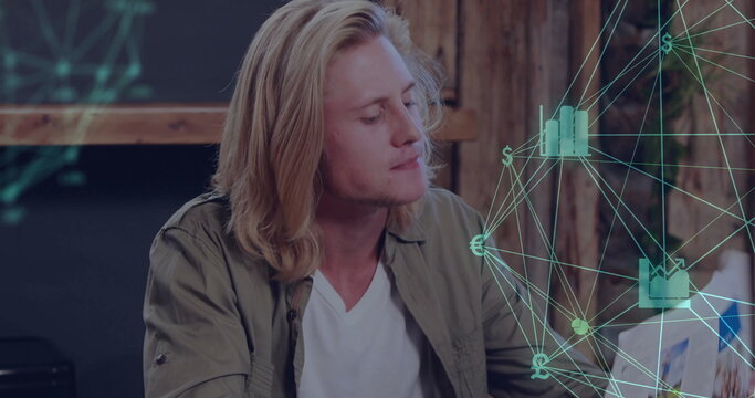 Adult man analyzing digital network graphic in office, with laptop hologram and chalk sketches - Powered by Adobe