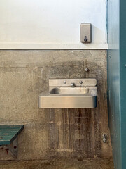 A Dirty Sink in a Unclean Public Restroom