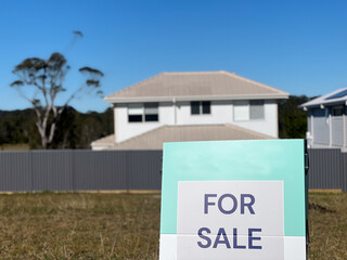 Land for sale sign in suburban neighborhood