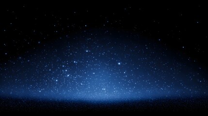 Obraz premium A dark night sky with many tiny, glowing stars.