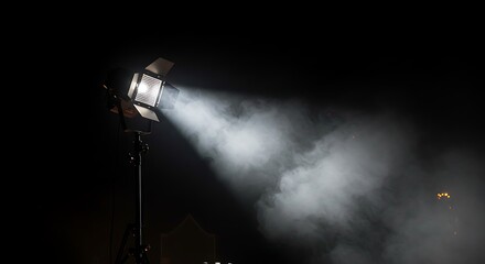 Studio spotlight with smoke effect on a dark stage background