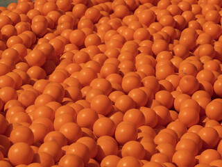 Obraz premium Vibrant Orange Ping Pong Balls Piled Together in Abundance