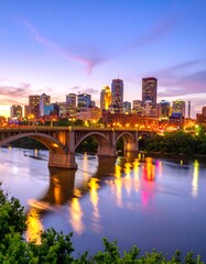 City skyline at dusk over river