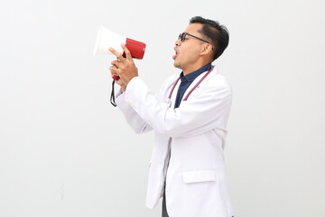 Asian adult male doctor wearing doctor's coat, stethoscope hanging on neck, white studio...