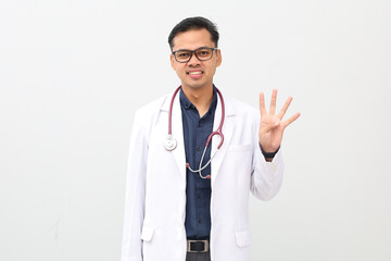 Asian adult male doctor standing, wearing doctor's coat, stethoscope hanging around neck, pointing...