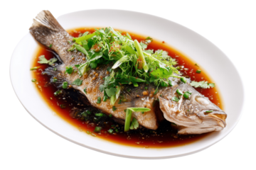 Whole steamed fish with herbs and soy sauce in white oval dish isolated on a transparent background cooked