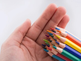 hand holding crayons