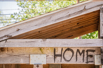 wooden dugout roof with the word 