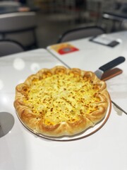 Close-Up of Pineapple Pizza on Table