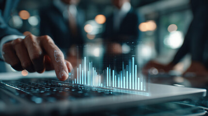 Digital data analysis with business person using laptop showing futuristic holographic chart and graph interface