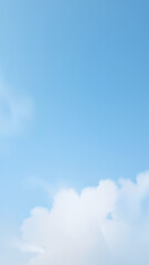 Clear, bright blue sky with soft, fluffy white clouds at the bottom, suggesting a serene and expansive atmosphere.