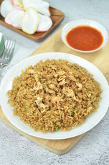 Delicious fried rice with egg, chilli, crackers and green onion, Indonesian dish.