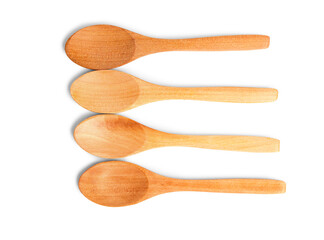 Empty wooden spoons isolated on white background