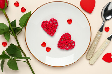 Beautiful table setting with hearts on beige background. Valentine's Day celebration