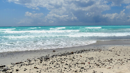 Turquoise Waves Under a Bright Sky