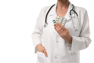 Healthcare worker shows medication packets, on white background