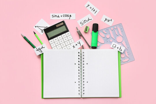 Notebook with calculator and school stationery on pink background - Powered by Adobe