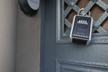 Lockbox mounted on an entrance door for secure access