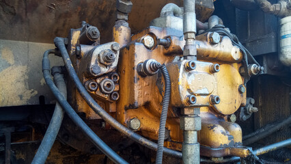 Steampunk inspired mechanical background composed of assorted vintage metal machinery, gears, and...