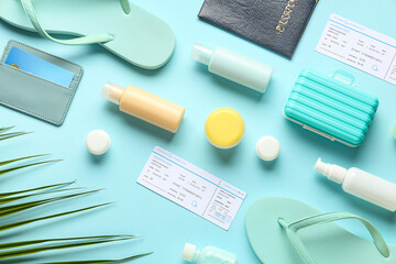 Composition with travel cosmetic kit, flip-flops and tickets on color background