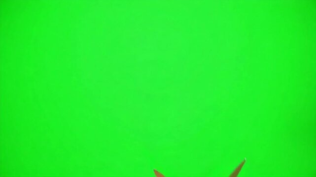 Sharp scissors cutting, ready for precise action on vibrant green background, perfect for edits