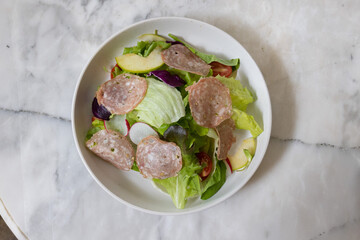 Fresh salad served in a glass bowl