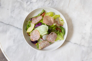 Fresh salad served in a glass bowl