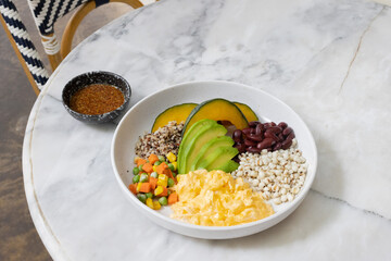 Spices and herbs with rice and fresh vegetables on a table