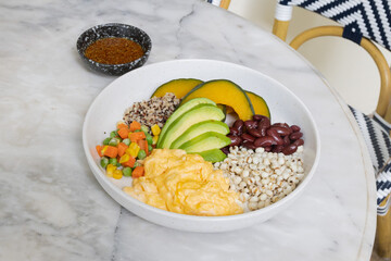 Spices and herbs with rice and fresh vegetables on a table