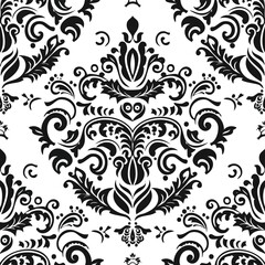 Obraz premium A black and white damask with a floral design on it 