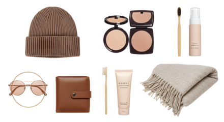 LIFESTYLE - Flat lay of brown winter accessories and beige makeup items including beanie, sunglasses, wallet, compact powder, brush, foundation, cream tube, and fringed scarf on white background