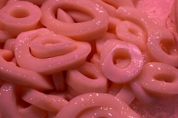Raw squid rings at the market. Human food of animal origin.