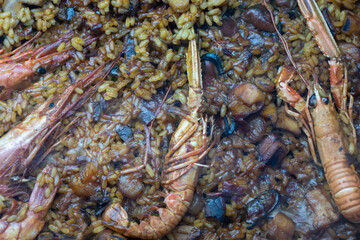 Spanish paella with sea creatures.