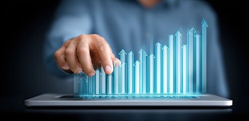 A hand interacts with a holographic bar graph, displaying upward trends on a tablet