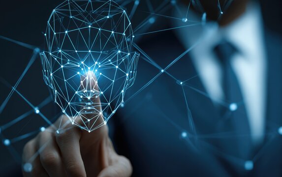 A hand points at a holographic face model, showcasing facial recognition technology