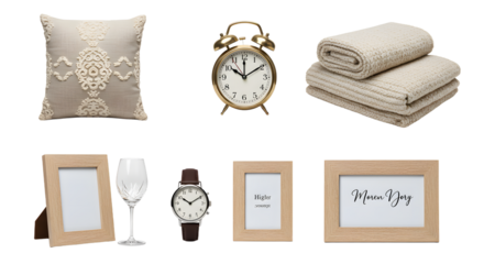 LIFESTYLE - Collection of beige home decor and accessories including pillow, alarm clock, folded towels, picture frames, wine glass, and wristwatch on white background
